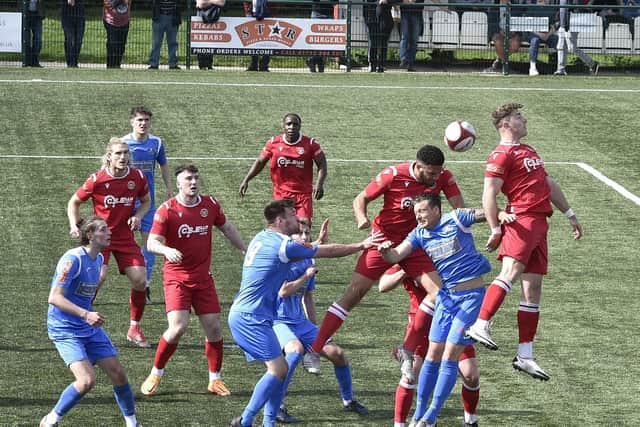 Stamford AFC (red) in action. Photo: David Lowndes.