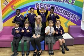 Principal Sonia Kendal with pupils from the school