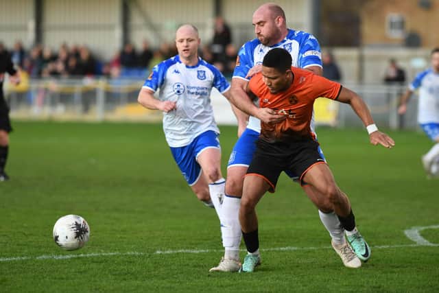 Kaine Felix (orange) in action for Sports against Tamworth. Photo: David Lowndes.