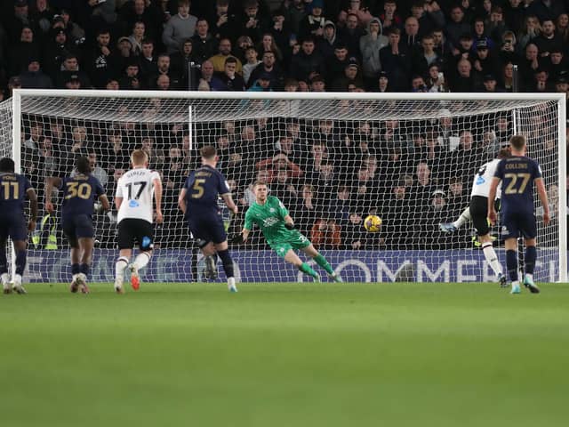 Posh goalkeeper Fynn Talley saving a penalty at Derby County. Unfortunately James Collins scored from the rebound. Photo: Joe Dent/theposh.com