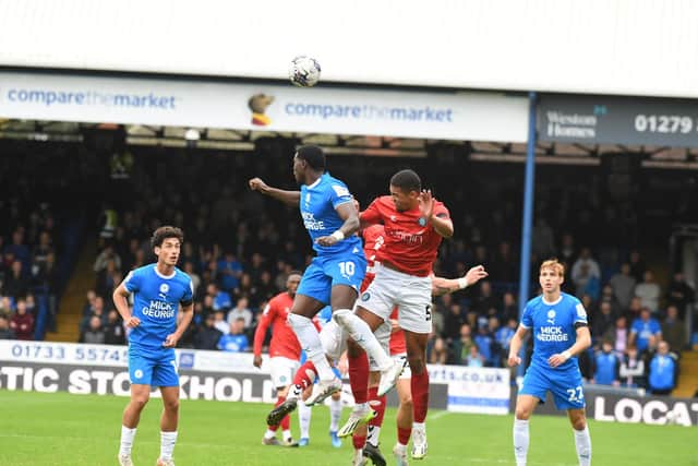 Posh star Ephron Mason-Clark makes an challenge in the game against Wycombe. Photo: David Lowndes.