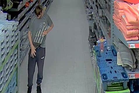 Cripps is seen on CCTV hiding the knives down his trousers