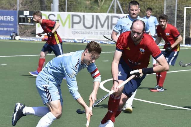 Paul Hillsden (red) scored for City of Peterborough against Harleston Magpies.
