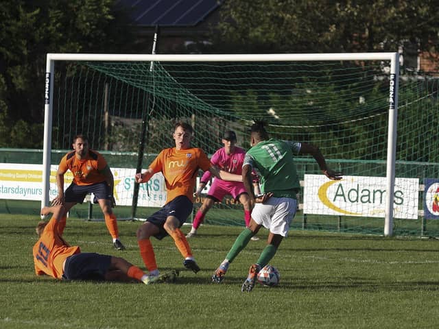 Ruben Sanches (green) is on his way to scoring for FC Peterborough against Diss. Photo: Tim Symonds
