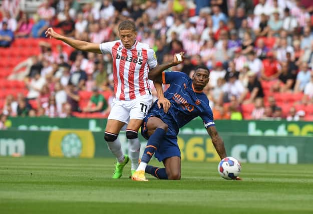 Dwight Gayle (left) in action for Stoke City. Photo by Tony Marshall/Getty Images.