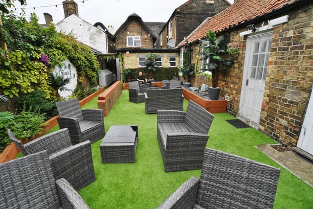 The New Crown pub's revamped beer garden is a far cry from the outdoor space that was "full of rubbish and overgrown" five months ago.