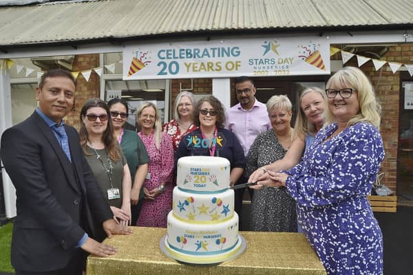 Kirsty Mulvaney and Lesley Barrett from OFSTED (right) with Mohammed Younis (CEO) , Mohammed Ashraf (commercial director) and staff from Stars Day Nurseries  celebrating the nursery's 20 birthday.
