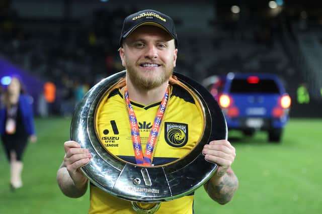 Jason Cummings with the A-League trophy. (Photo by Scott Gardiner/Getty Images)