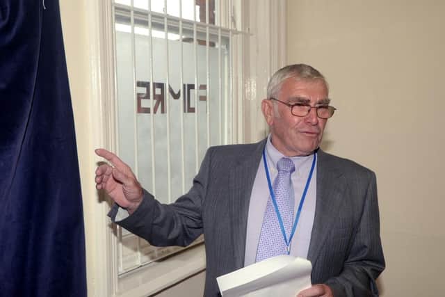 Councillor Ralph Butcher, pictured in 2014 officially opening of the community rooms at March Station, campaigned for 50 years to bypass the level crossing.