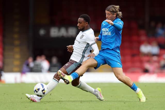Chris Conn-Clarke (right) in action for Posh.