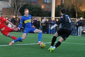 Bart Cybulski (blue) in action for Spalding United. Photo Chris Lowndes.