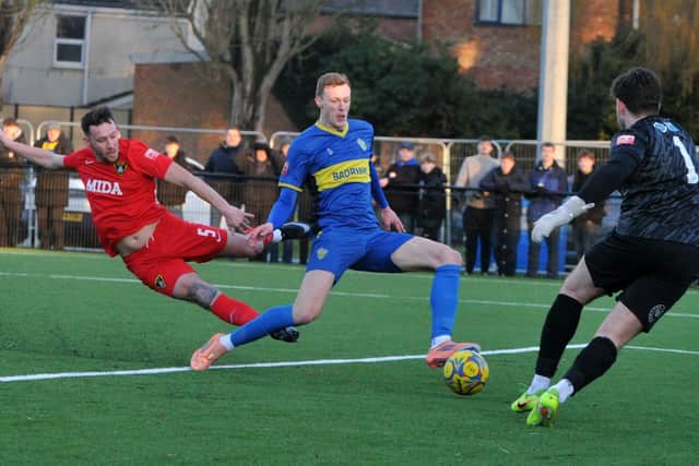 Bart Cybulski (blue) in action for Spalding United. Photo Chris Lowndes.