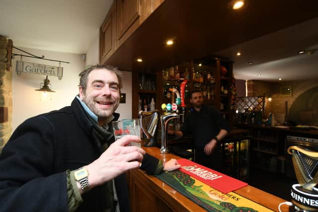 Oliver Thorley, enjoying a pint in the Paper Mills, describes Wansford as a “drawbridge village."