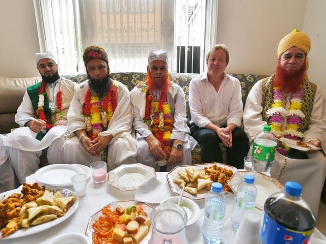 Peterborough Grand Mawlid parade from Alderman's Drive to celebrate the life and legacy of the Prophet Muhammad. MP for Peterborough Paul Bristow with the VIP's leading the parade.
