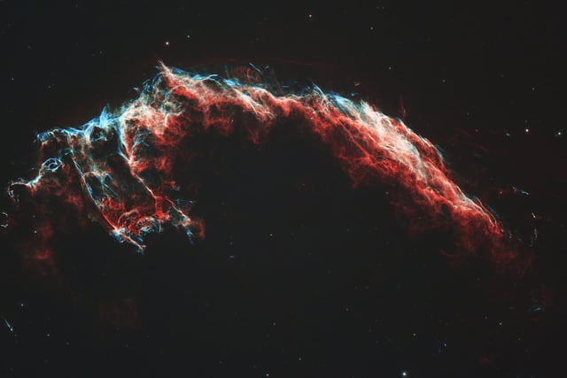 Described by NASA as the "most spooktastic nebula in the galaxy", IC1340 - better known as 'The Bat Nebula' is an eastern portion of the Veil Nebula, a large supernova remnant in the constellation of Cygnus. Often referred to as the Cygnus Loop, this Nebula is a great sphere of expanding gas that came from a star which was 20 times more massive than our own Sun that exploded in a supernova between 10-20 thousand years ago.