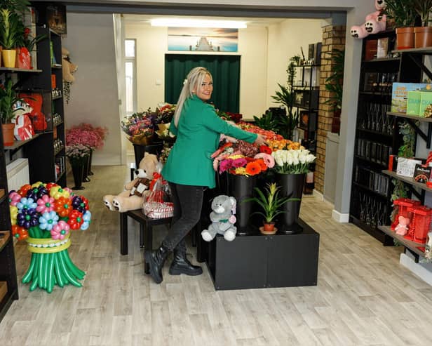 Eginta Ilgavyzyte arranges the displays in her shop Flowers & Gifts in Lincoln Road, Peterborough