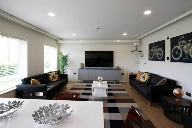 An example of one of the bedrooms available for residents, with physical hoist in all the rooms.