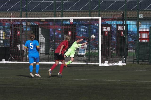 Keeley Steward makes a save for Peterborough Sports against Netherton United.  Photo: Tim Symonds