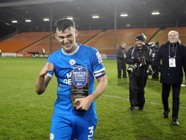 Harrison Burrows with his man-of-the-match award from the EFl Trophy semi-final. Photo Joe Dent/theposh.com.