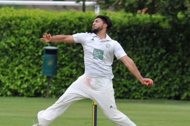 Hayatullah Niazi bowling for Market Deeping.