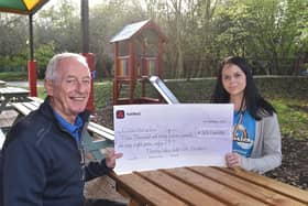 Pat Reidy, club captain of Thorney Lakes Golf Club, presents a cheque for £3,067 to Nikita Lack, centre manager at the Little Miracles charity, in Ravensthorpe