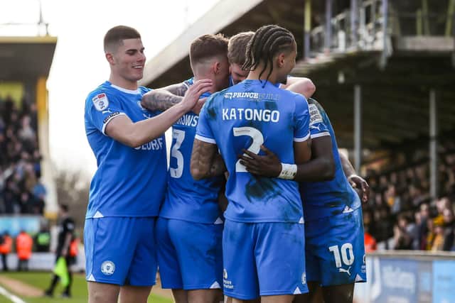 Posh players celebrate their goal at Cambridge. Photo Joe Dent/theposh.com