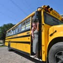 Charlotte Scriven and baby Alistair with their US school bus.
