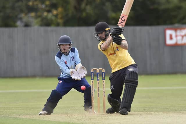 Chris Milner on his way to 48 for Peterborough Town against Geddington. Photo David Lowndes.
