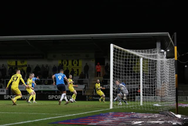 Jonson Clarke-Harris of Peterborough United scores his second goal at Burton. Photo: Joe Dent/theposh.com,