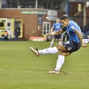 Posh skipper Jonson Clarke-Harris shoots in the early stages of the game against Wycombe. Photo: David Lowndes.