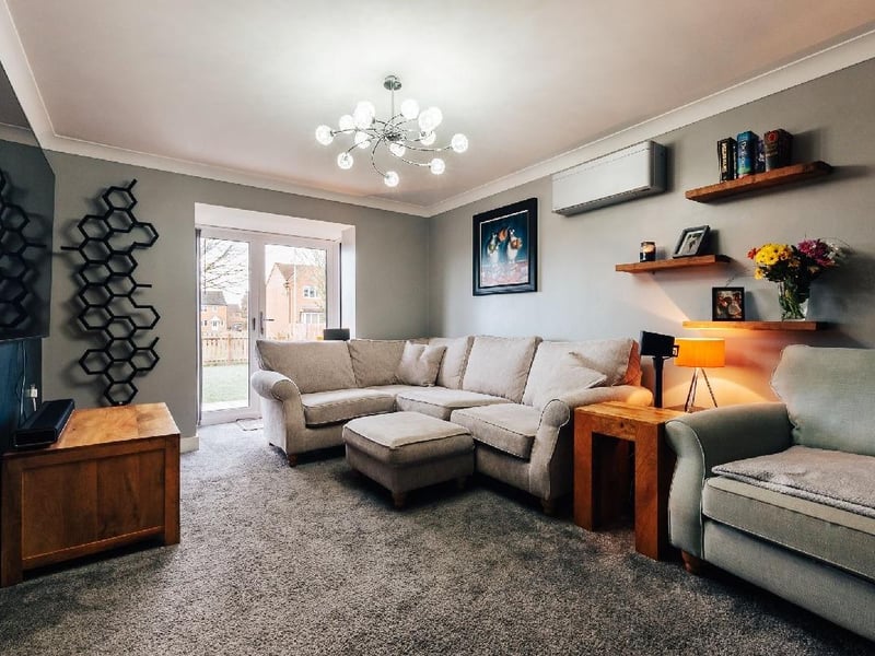 The lounge showing doors opening onto rear garden