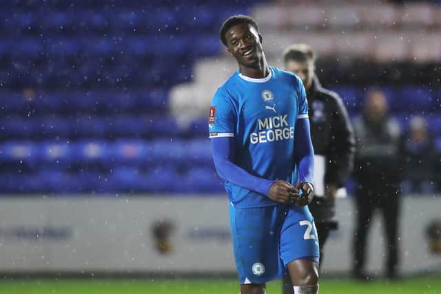 Emmanuel Fernandez of Peterborough United smiles at full-time after scoring a late equalising goal against Salford. Photo: Joe Dent.