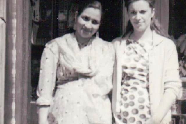 Ranjit & Margaret outside the shop in Cromwell Road. Photo: Del Singh