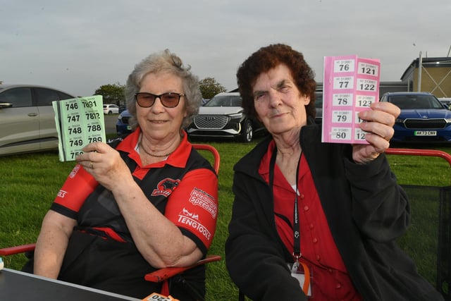 Long serving volunteers Jeannette Arnold and Pauline Rowley selling raffle tickets.