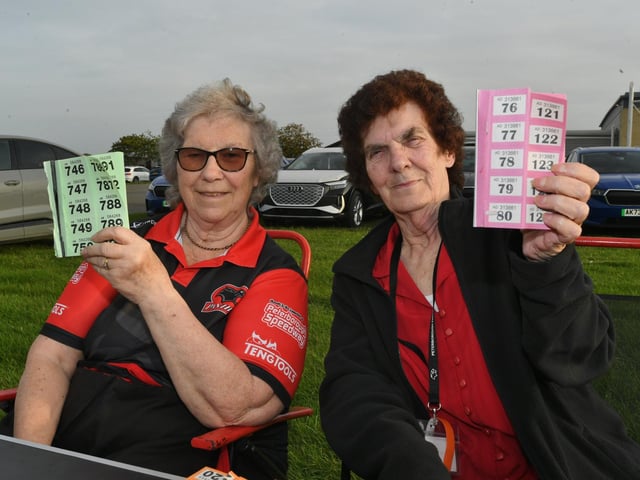 Long serving volunteers Jeannette Arnold and Pauline Rowley selling raffle tickets.