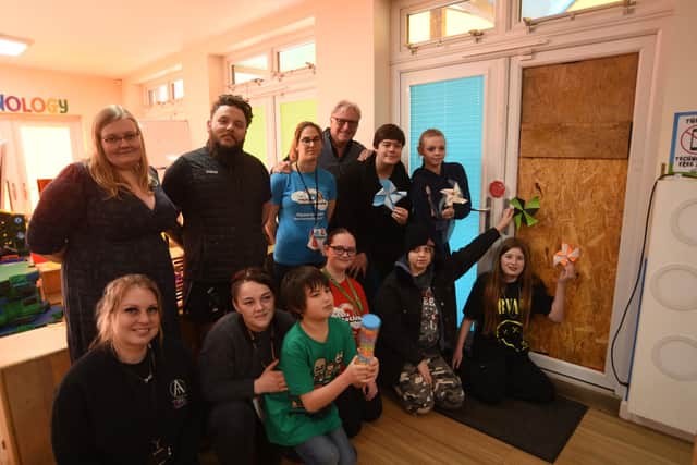 Charity CEO Michelle King' with staff, volunteers and children at Little Miracles