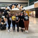 Staff get ready to open the Black Sheep Coffee kiosk in the Queensgate Shopping Centre in Peterborough