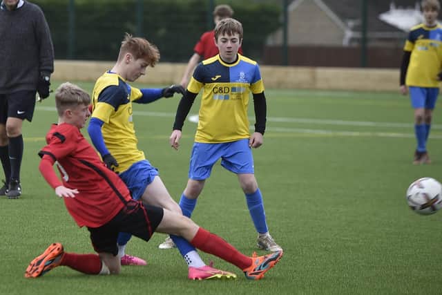 A strong tackle by a Netherton U15 player in their League Cup game with Ketton. Photo: David Lowndes.