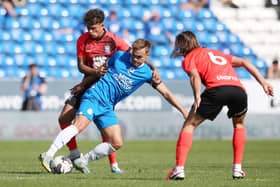 Archie Collins (blue) battles for the ball against Birmingham City last weekend. Photo: Joe Dent/theposh.com