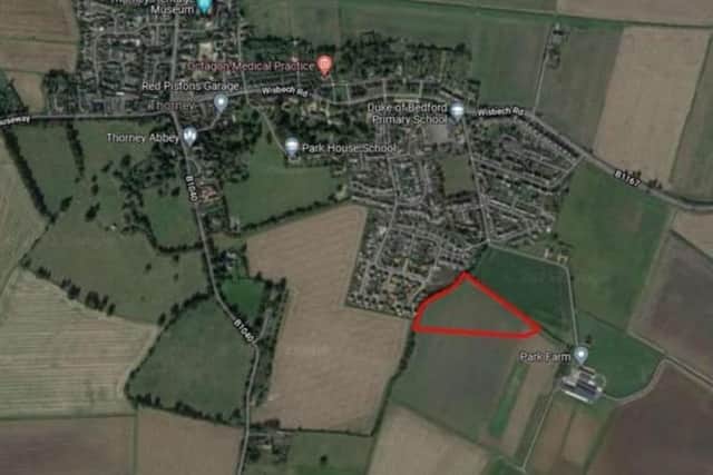 The map of the development site, circled in red.