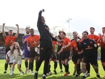 Peterborough Sports' joint-boss Luke Steele leads the celebrations at King's Lynn. Photo Darren Wiles.