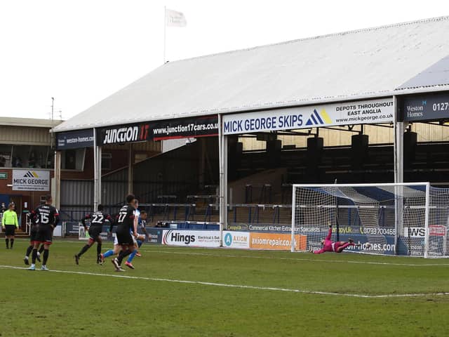 Jonson Clarke-Harris scores the penalty against Lincoln that earned Posh promotion from League One in May, 2021. Photo Joe Dent/theposh.com.