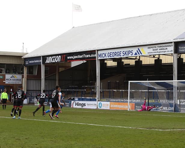 Jonson Clarke-Harris scores the penalty against Lincoln that earned Posh promotion from League One in May, 2021. Photo Joe Dent/theposh.com.