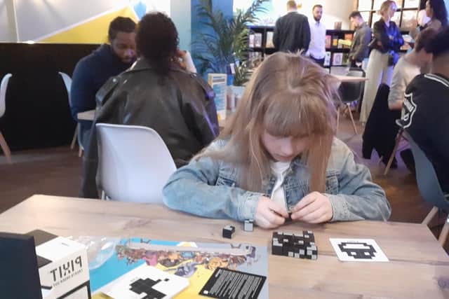 Sasha gets to grips with Pixit at The Dice Box in Bridge Street, Peterborough