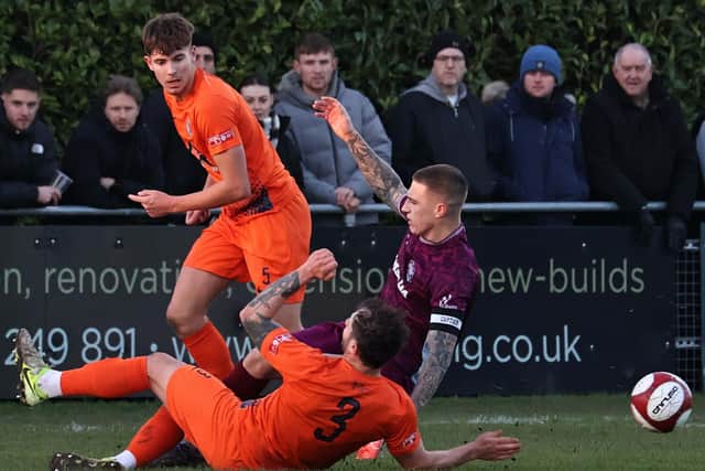 Action from Bourne Town v Corby Town (orange). Photo Dave Mears
