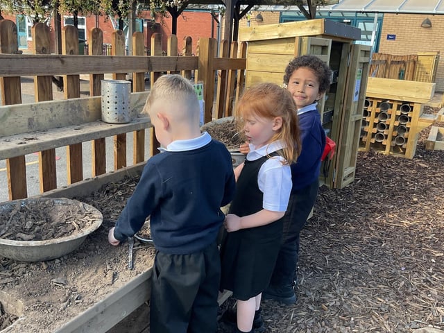 Pupils get their hands dirty in the new mud kitchen