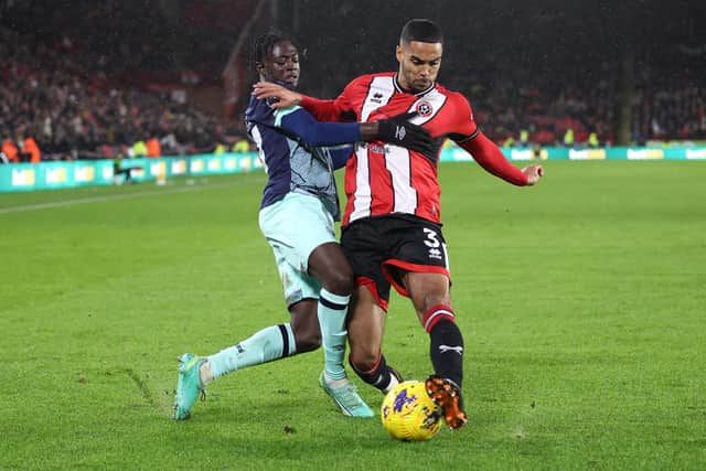 Michael Olakigbe (right) in action for Brentford. Photo by George Wood/Getty Images.