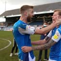 Mark Beevers and Frankie Kent celebrate winning promotion for Posh in 2021. Photo: Joe Dent.