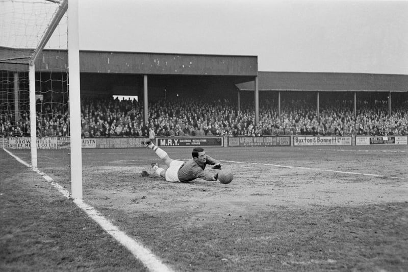 Peterborough United keeper is pictured making a save during a match between Walsall FC and Peterborough United at Fellows Park Stadium in Walsall on 1st March 1965.