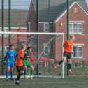 Fin Shevlane heads the ball clear for Nene Valley during their 4-2 defeat at RTC in an Under 18 League match. Photo: Charlotte Edwards.